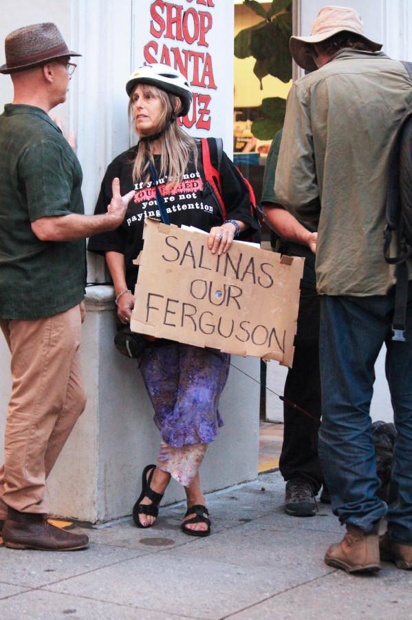 Protesters discussing in front of Santa Cruz Bookshop.