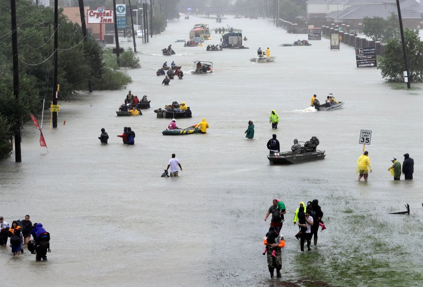 Rescue+boats+fill+a+flooded+street+at+flood+victims+are+evacuated+as+floodwaters+from+Tropical+Storm+Harvey+rise+Monday%2C+Aug.+28%2C+2017%2C+in+Houston.+%28AP+Photo%2FDavid+J.+Phillip%29