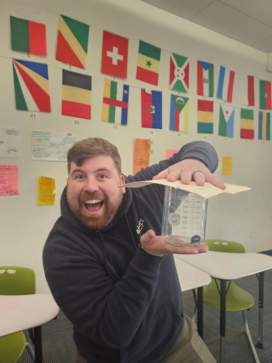 Former chemistry teacher Mr. Winter posed with mouse he caught in Ms. Jots room, last year.